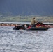 Experts prepare a U.S. Navy P-8A Poseidon in Kaneohe Bay for Salvage Operations