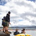 Experts prepare a U.S. Navy P-8A Poseidon in Kaneohe Bay for Salvage Operations