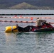 Experts prepare a U.S. Navy P-8A Poseidon in Kaneohe Bay for Salvage Operations