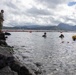 Experts prepare a U.S. Navy P-8A Poseidon in Kaneohe Bay for Salvage Operations