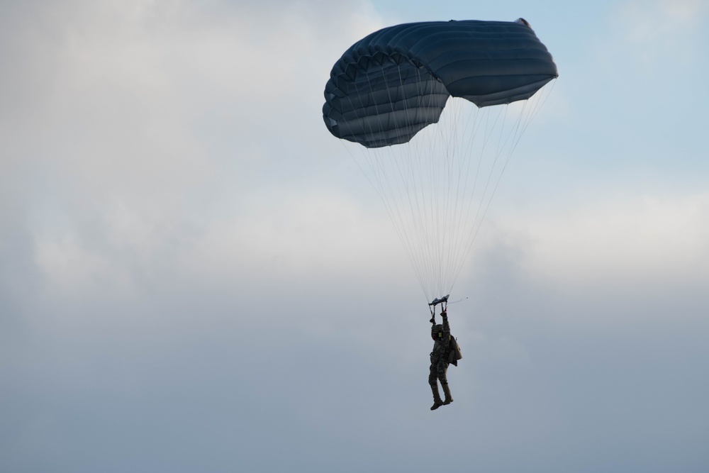 Air Force special warfare Airmen, Alaska Air National Guard aviators, and Army paratroopers conduct airborne training at JBER