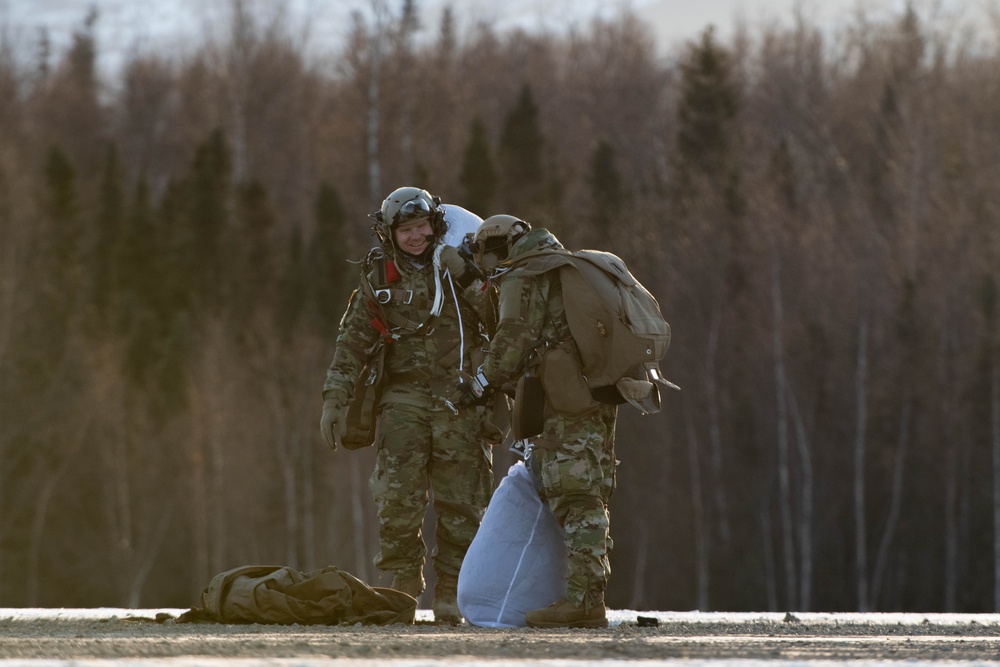 Air Force special warfare Airmen, Alaska Air National Guard aviators, and Army paratroopers conduct airborne training at JBER