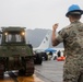 Experts prepare a U.S. Navy P-8A Poseidon in Kaneohe Bay for Salvage Operations