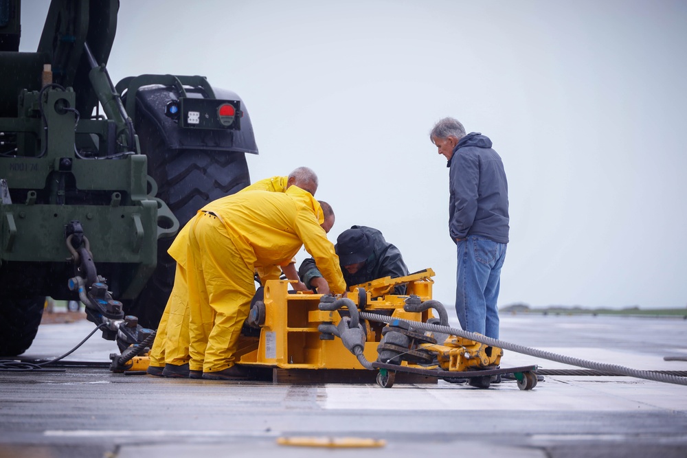 Experts Position Salvage Roller Bags During Salvage Preparation of U.S. Navy P-8A Poseidon in Kaneohe Bay.