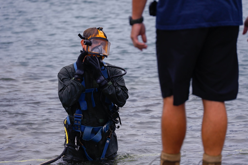 Experts Position Salvage Roller Bags During Salvage Preparation of U.S. Navy P-8A Poseidon in Kaneohe Bay.