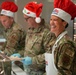 The 114th Fighter Wing leadership serve holiday meal to Airmen