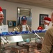 The 114th Fighter Wing leadership serve holiday meal to Airmen