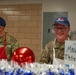 The 114th Fighter Wing leadership serve holiday meal to Airmen