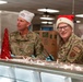 The 114th Fighter Wing leadership serve holiday meal to Airmen