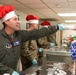 The 114th Fighter Wing leadership serve holiday meal to Airmen