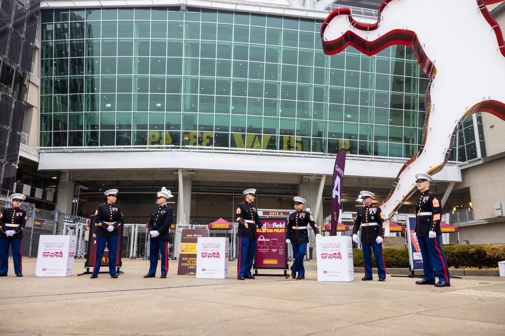 U.S. Marines with Marine Corps Base Quantico and Marine Corps Forces Reserve participate in the Toys for Tots toy drive at the Washington Commanders football game