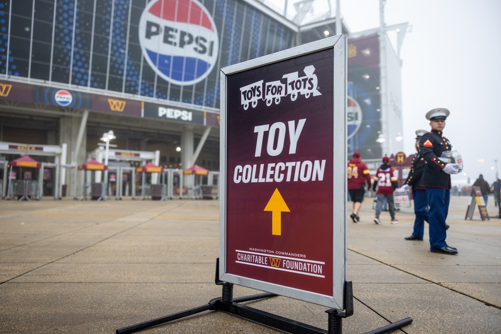 U.S. Marines with Marine Corps Base Quantico and Marine Corps Forces Reserve participate in the Toys for Tots toy drive at the Washington Commanders football game