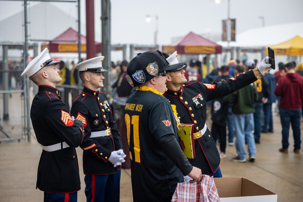 U.S. Marines with Marine Corps Base Quantico and Marine Corps Forces Reserve participate in the Toys for Tots toy drive at the Washington Commanders football game