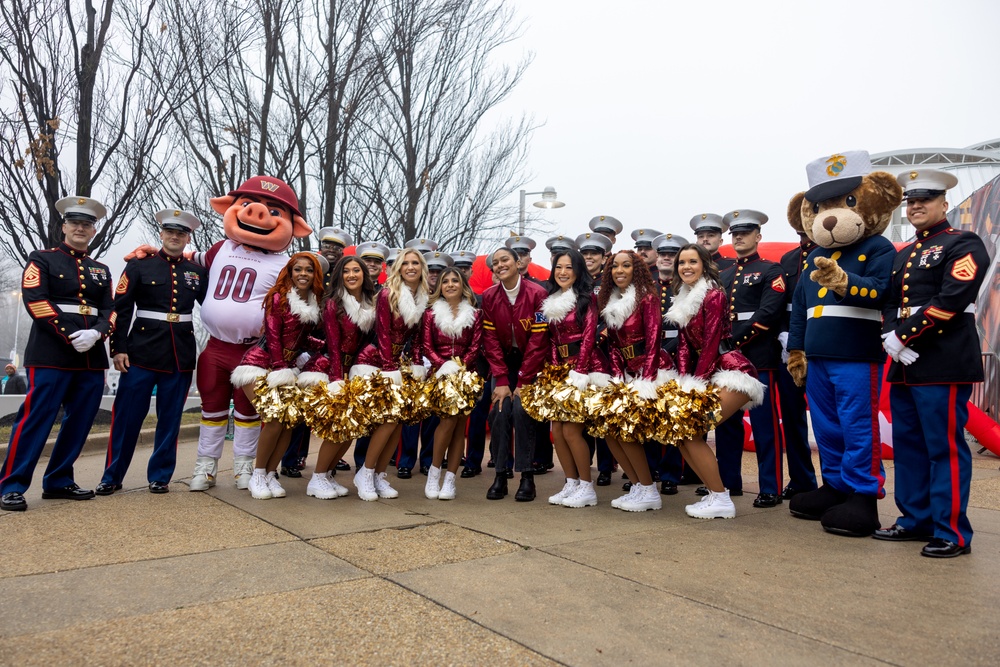 U.S. Marines with Marine Corps Base Quantico and Marine Corps Forces Reserve participate in the Toys for Tots toy drive at the Washington Commanders football game