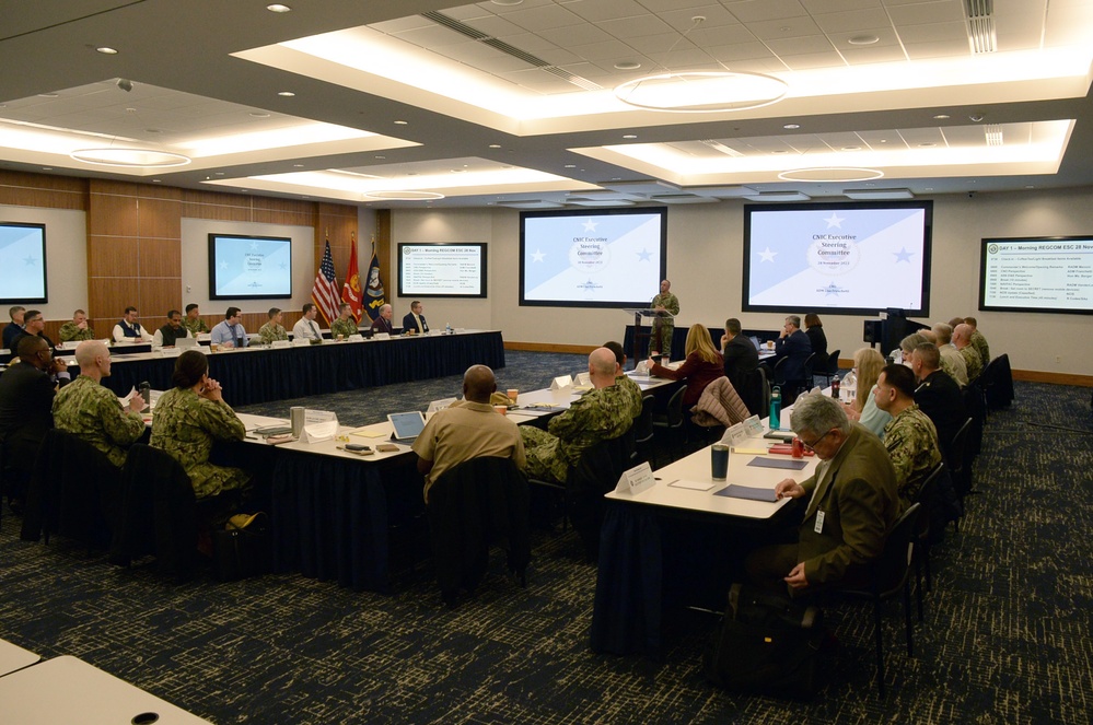 Rear Adm. John Menoni, acting commander of Navy Installations Command (CNIC) speaks to region commanders and leadership during the annual CNIC Executive Steering Committee