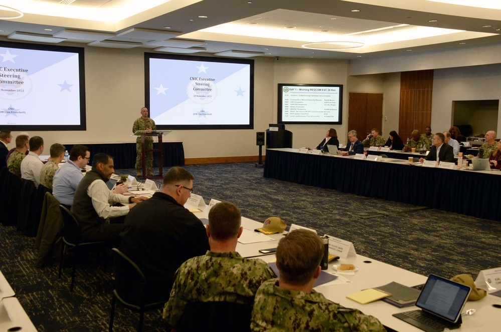 Rear Adm. John Menoni, acting commander of Navy Installations Command (CNIC) speaks to region commanders and leadership during the annual CNIC Executive Steering Committee