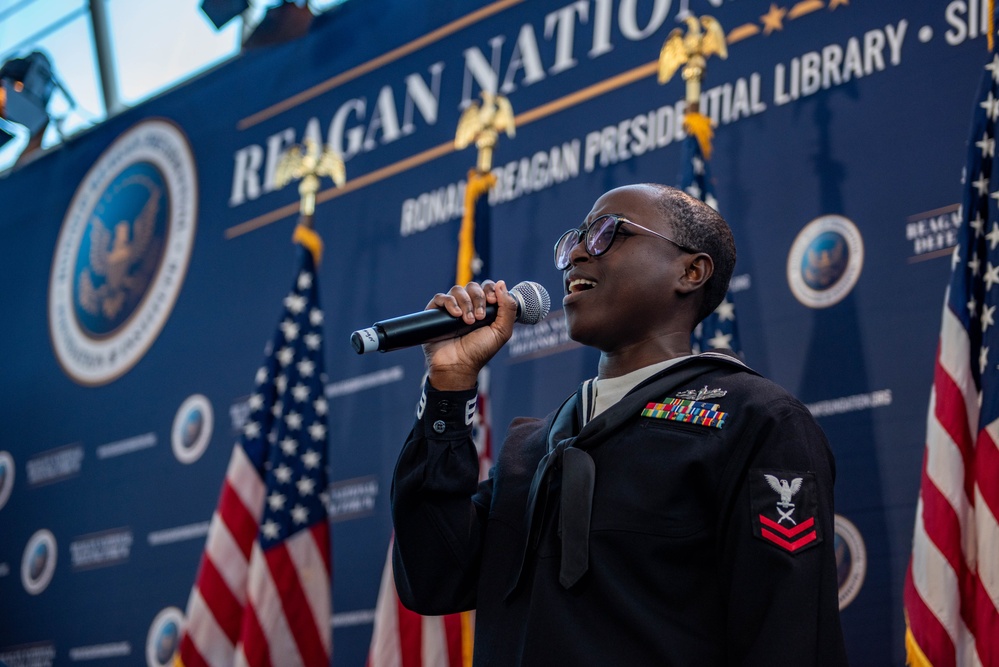 USS Ronald Reagan (CVN 76) Sailor sings national anthem at Reagan National Defense Forum