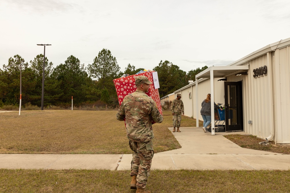 11th CYB delivers toys to Fort Eisenhower Christmas House 07