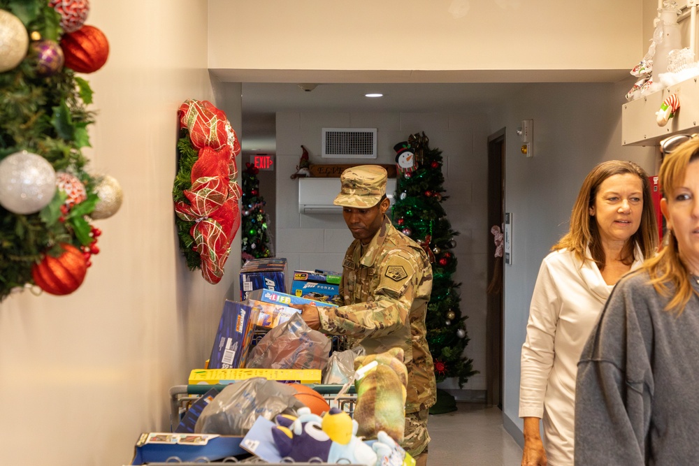 11th CYB delivers toys to Fort Eisenhower Christmas House 10
