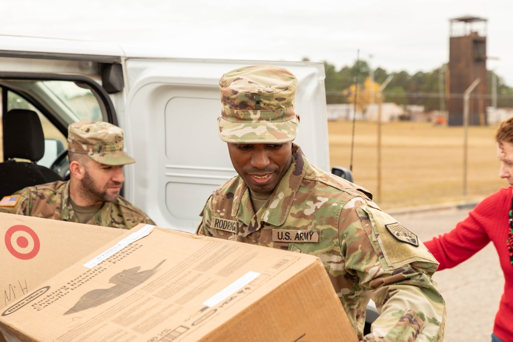 11th CYB delivers toys to Fort Eisenhower Christmas House 15