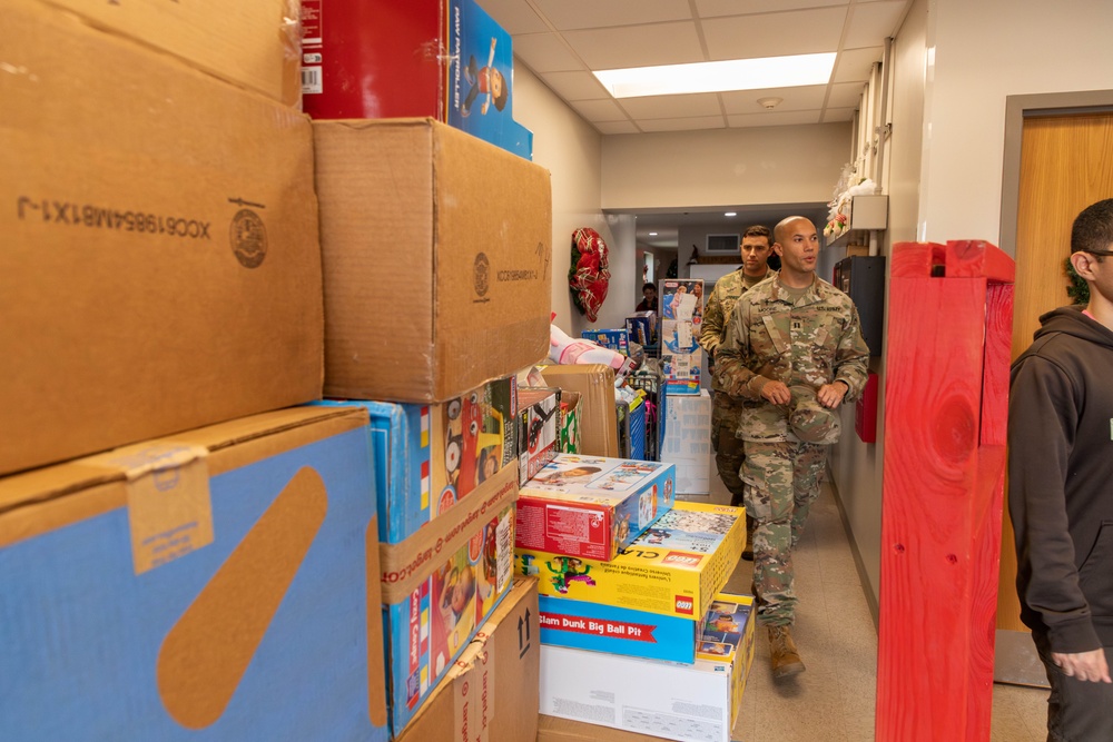 11th CYB delivers toys to Fort Eisenhower Christmas House 19