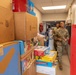 11th CYB delivers toys to Fort Eisenhower Christmas House 19