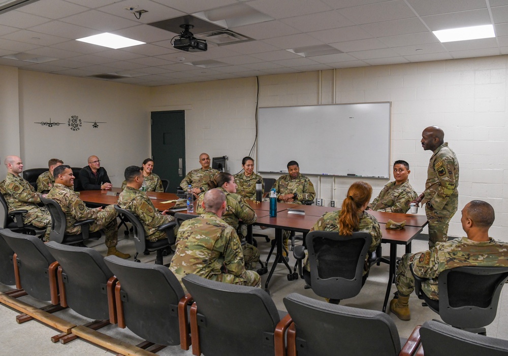 U.S. Air Force Chief Master Sgt. Aaron Dent speaks with first sergeants assigned to the 106th Rescue Wing