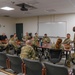 U.S. Air Force Chief Master Sgt. Aaron Dent speaks with first sergeants assigned to the 106th Rescue Wing