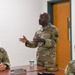 U.S. Air Force Chief Master Sgt. Aaron Dent speaks with first sergeants assigned to the 106th Rescue Wing