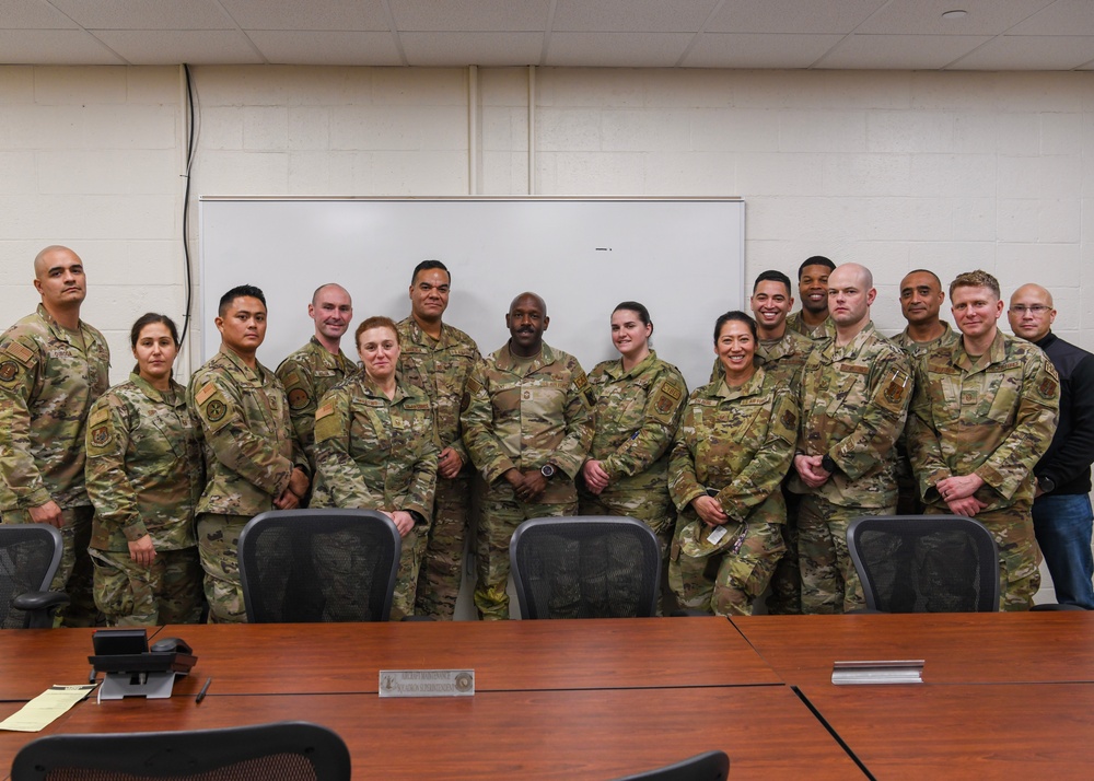 U.S. Air Force Chief Master Sgt. Aaron Dent speaks with first sergeants assigned to the 106th Rescue Wing