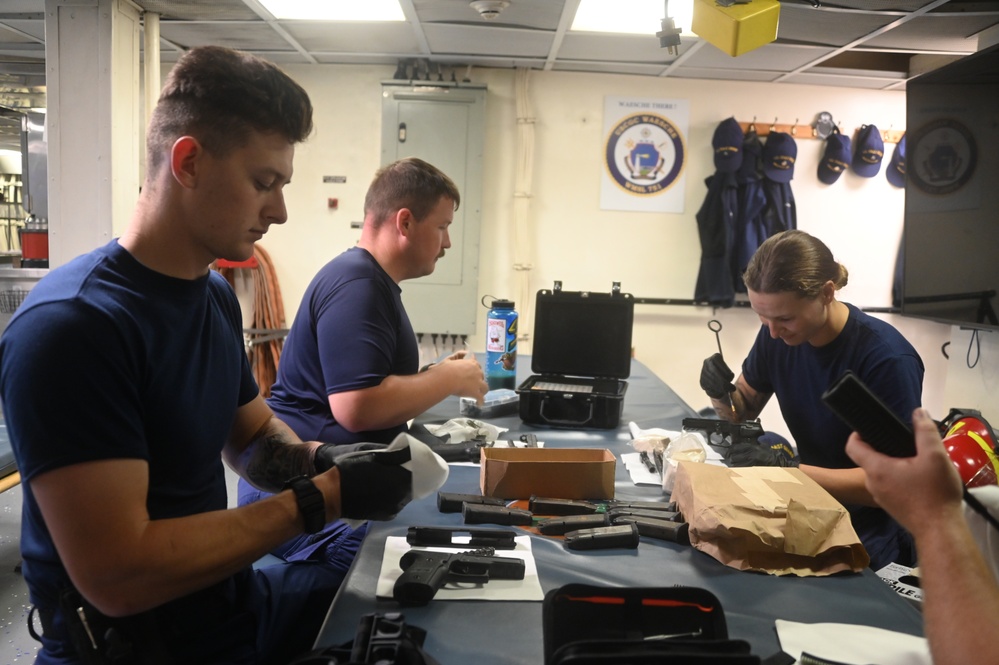 U.S. Coast Guard Cutter Waesche crew members transfer narcotics seized in the Eastern Pacific Ocean