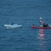 U.S. Coast Guard Cutter Waesche crew members transfer narcotics seized in the Eastern Pacific Ocean