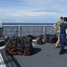 U.S. Coast Guard Cutter Waesche crew members transfer narcotics seized in the Eastern Pacific Ocean