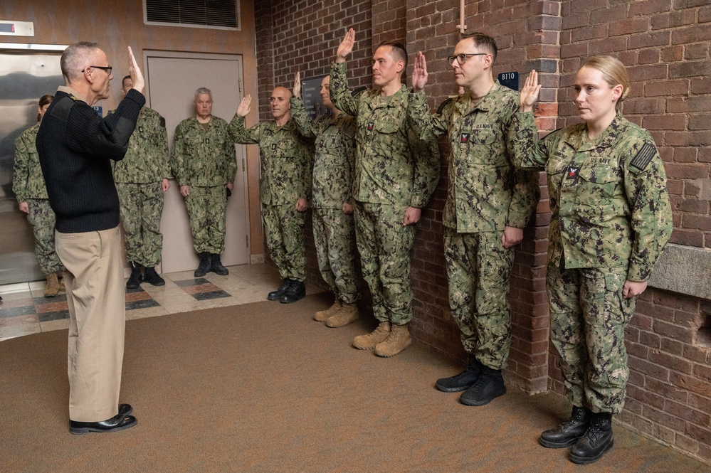 Members of the U.S. Navy Band participate in a reenlistment ceremony