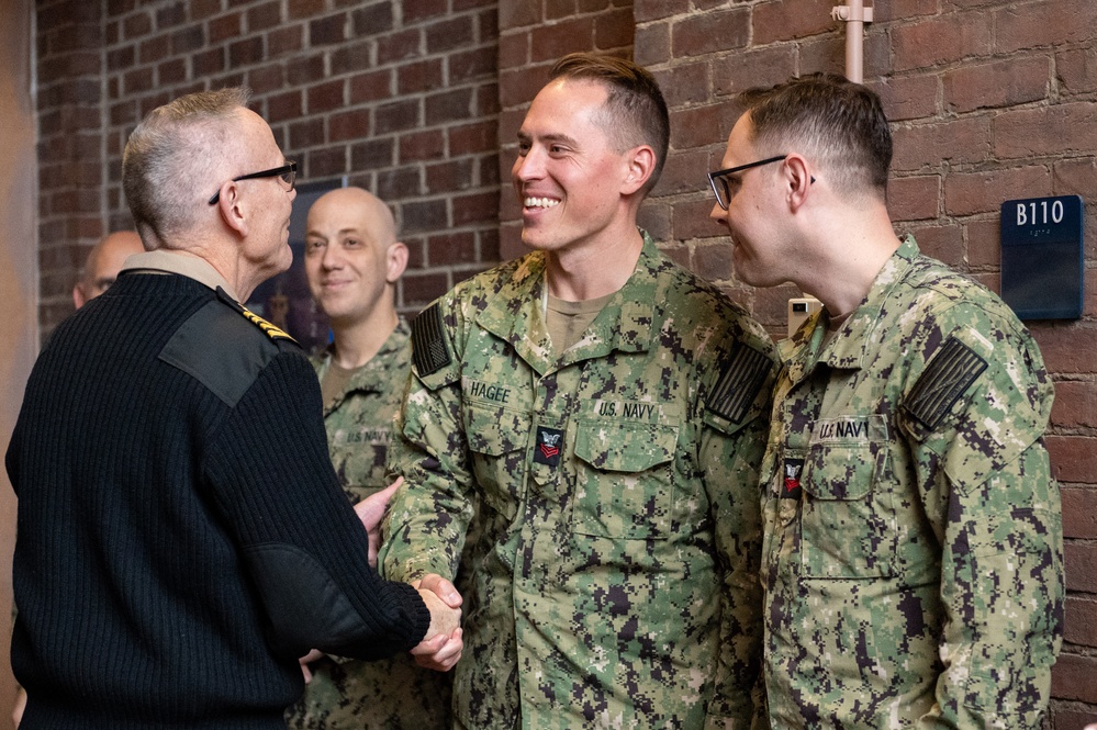 Members of the U.S. Navy Band participate in a reenlistment ceremony