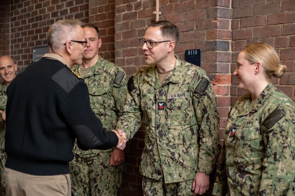 Members of the U.S. Navy Band participate in a reenlistment ceremony