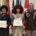 Daughters of Sgt. Maj. Felix Lassus display BRAT certificates during their father's retirement ceremony