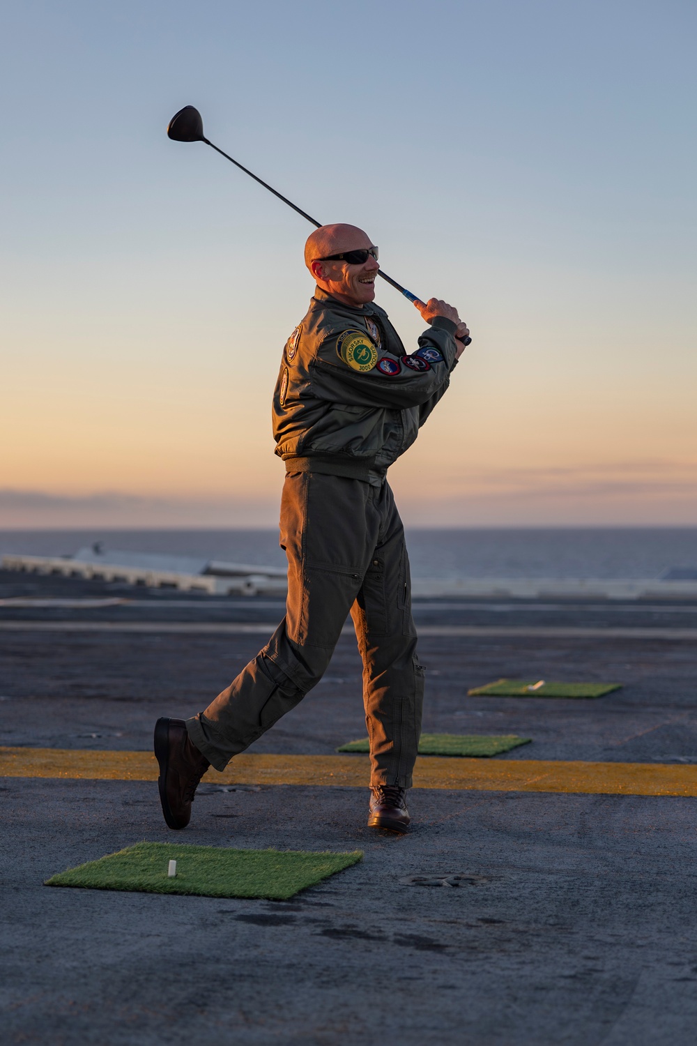 Abraham Lincoln Sailors golf on the flight deck