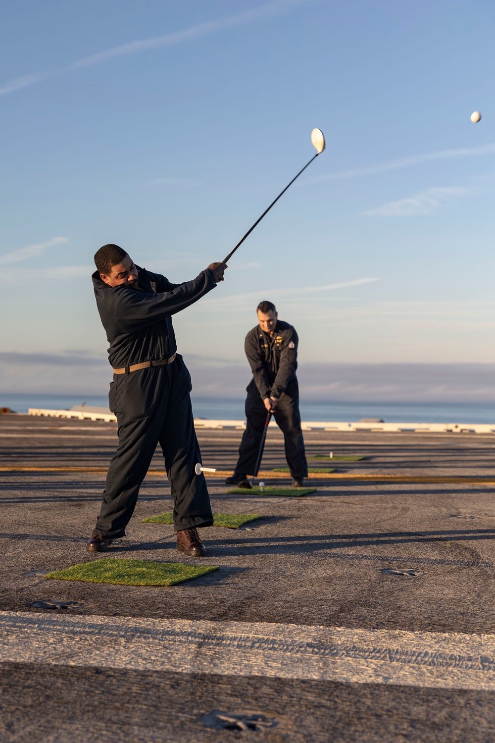 Abraham Lincoln Sailors golf on the flight deck