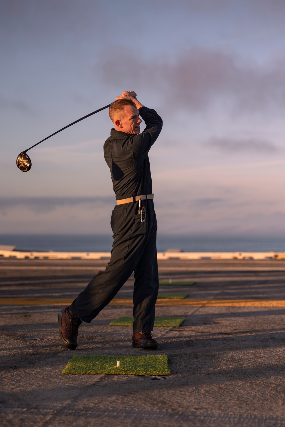 Abraham Lincoln Sailors golf on the flight deck