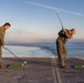 Abraham Lincoln Sailors golf on the flight deck