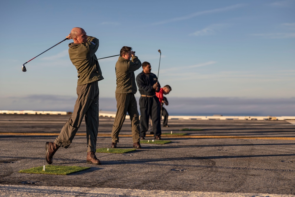 Abraham Lincoln Sailors golf on the flight deck