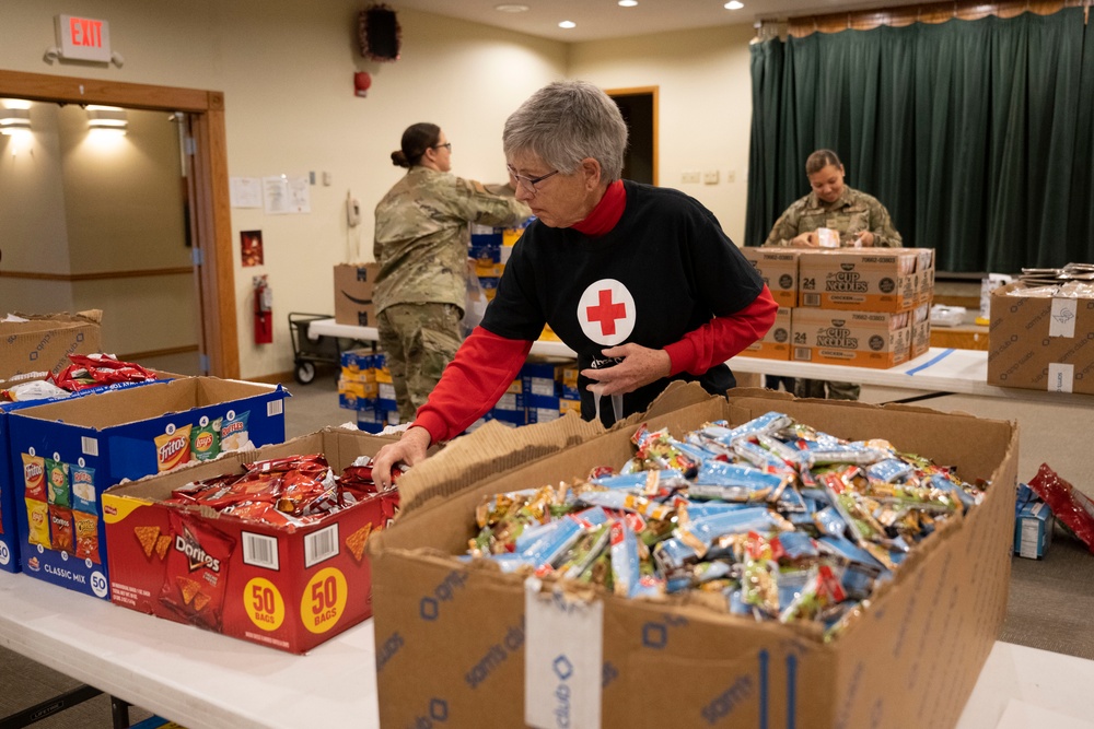 Annual Raider Holiday Cheer event provides gift bags to Airmen