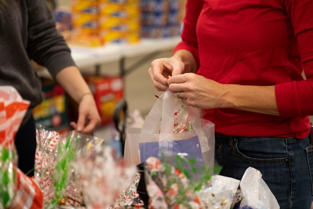 Annual Raider Holiday Cheer event provides gift bags to Airmen