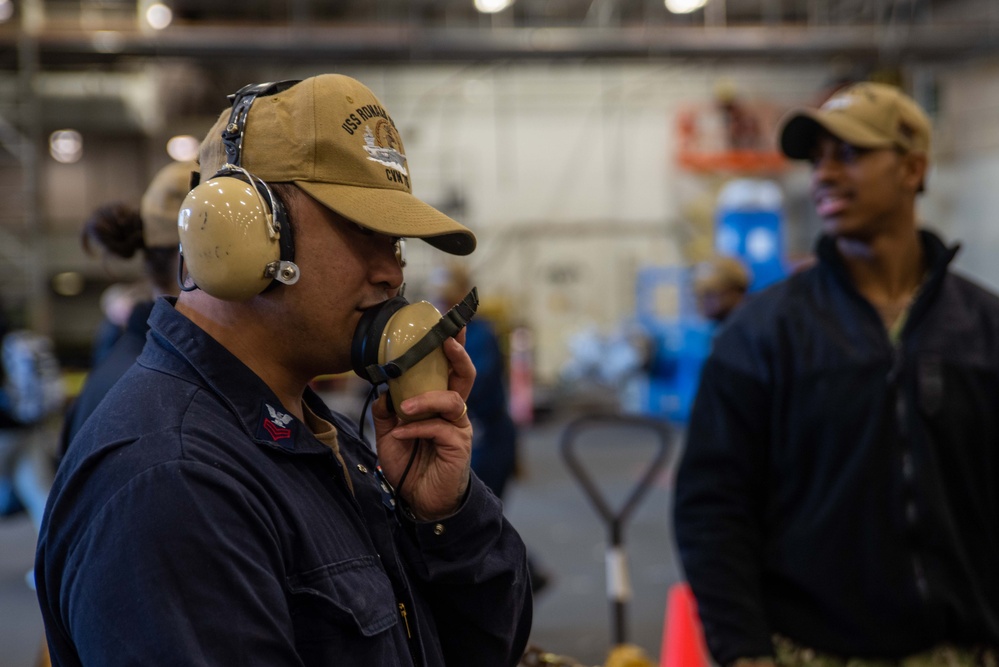 USS Ronald Reagan (CVN 76) Sailors move cargo