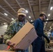 USS Ronald Reagan (CVN 76) Sailors move cargo