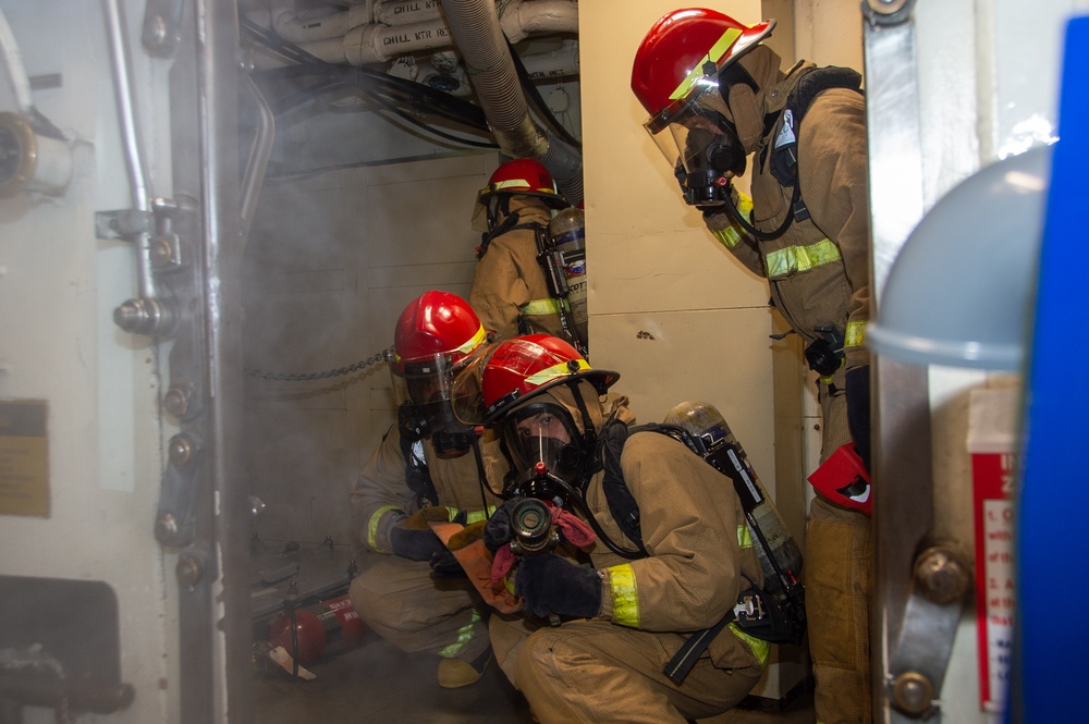 USS Ronald Reagan (CVN 76) conducts a joint damage control drill