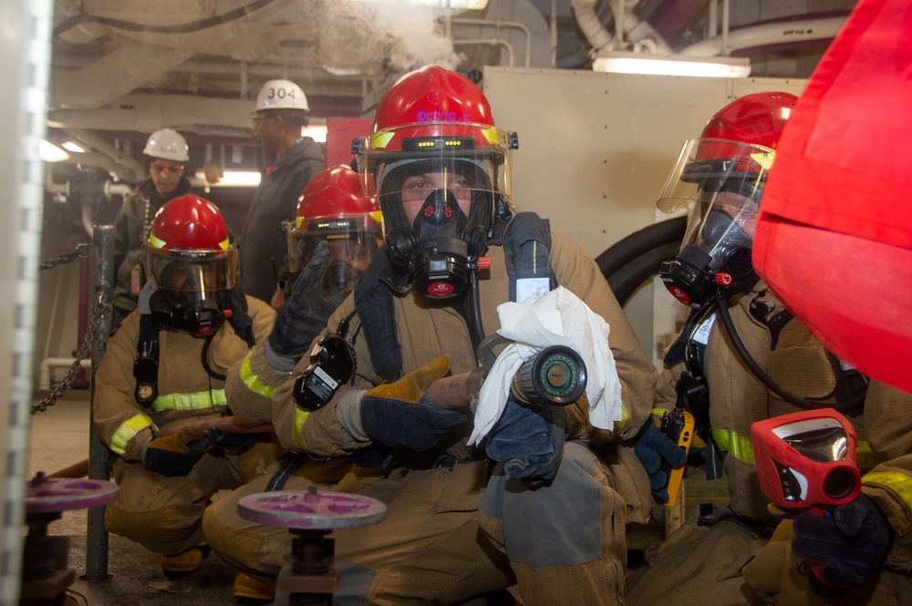 USS Ronald Reagan (CVN 76) conducts a joint damage control drill