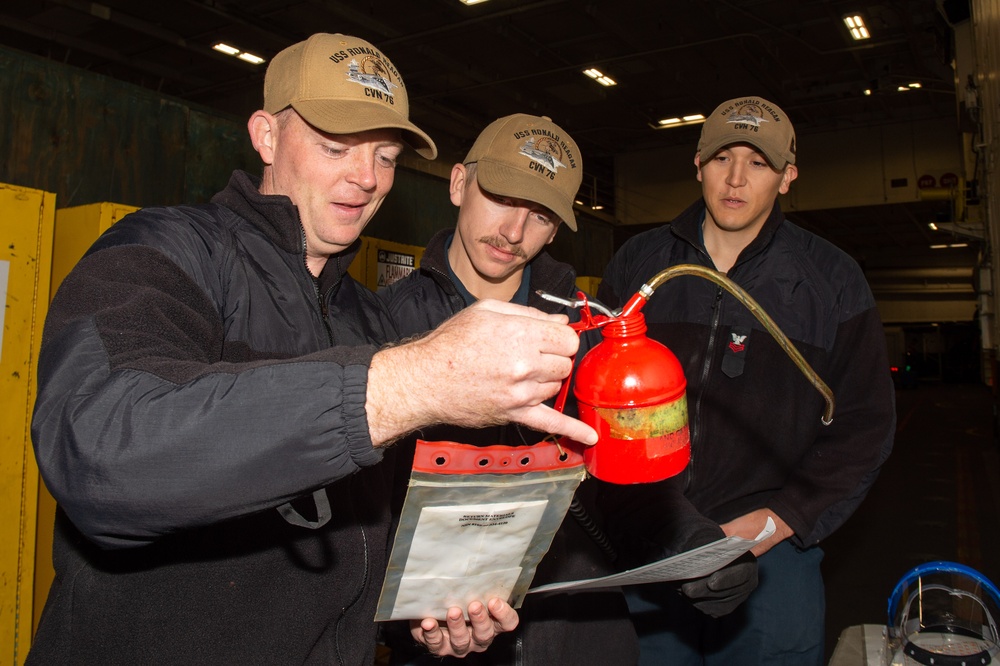 USS Ronald Reagan (CVN 76) Sailors perform planned maintenance and spot checks