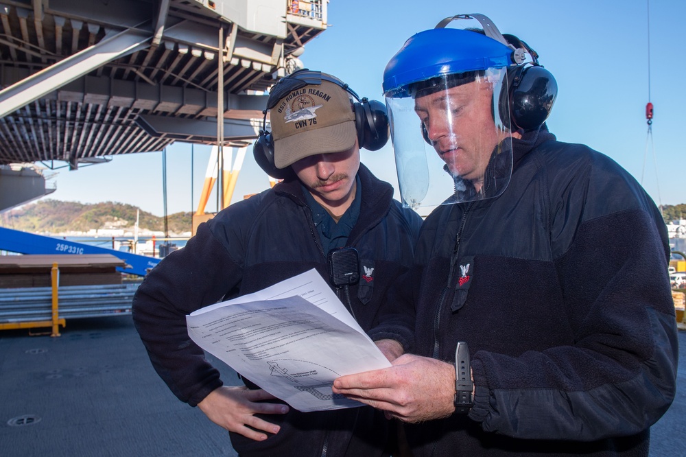 USS Ronald Reagan (CVN 76) Sailors perform planned maintenance and spot checks